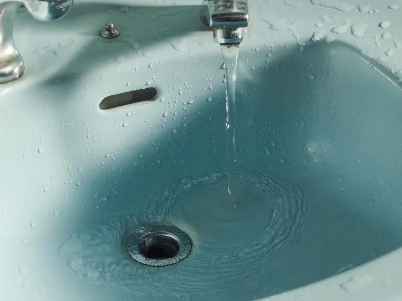Sink with tap running